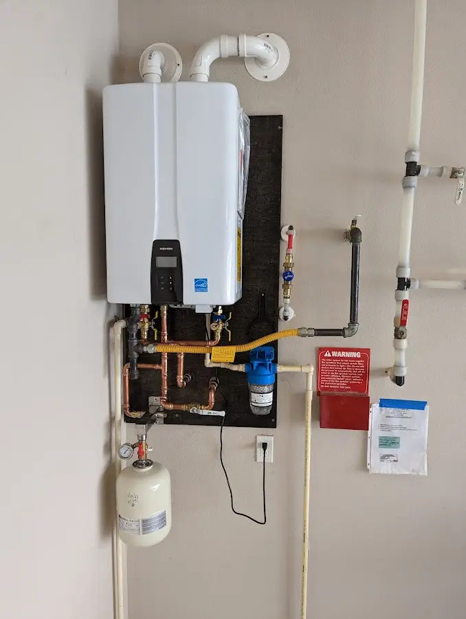 Professional plumber installing copper piping in a Shrewsbury home